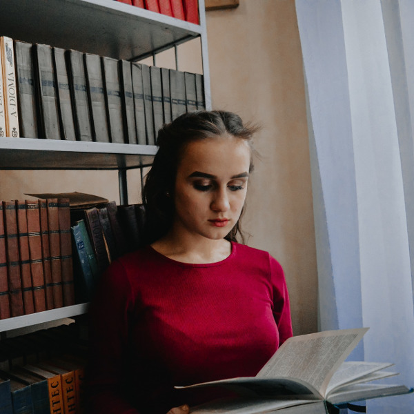 Woman reading a book in the library